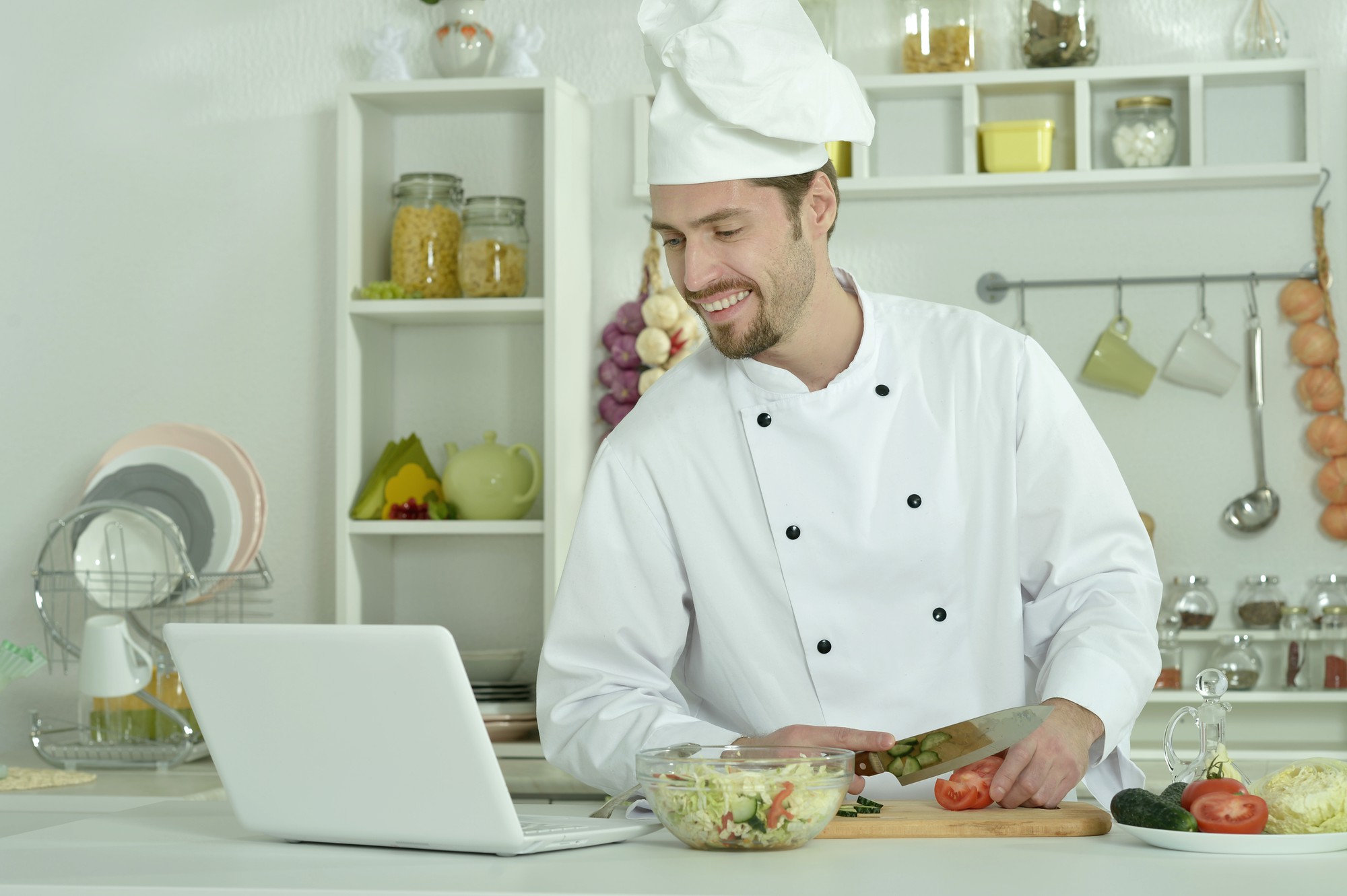 Online chef consulting via laptop